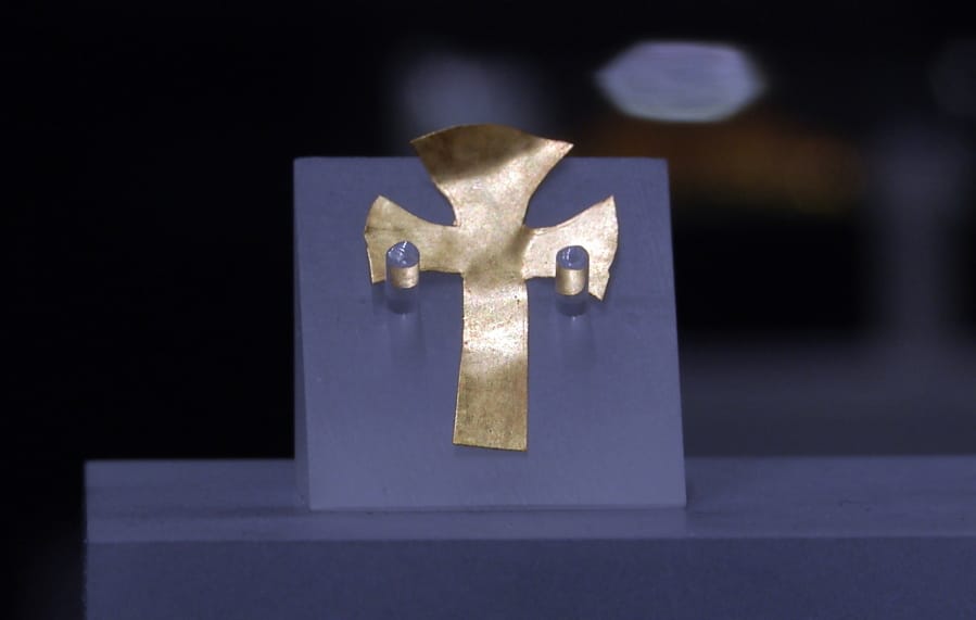 A gold foil cross uncovered at an Anglo-Saxon burial site in the village of Prittlewell in 2003 is displayed at Southend Central Museum on Thursday in Southend, England.