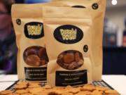 Dog treats are displayed at the Cannabis World Congress & Business Exposition trade show, Thursday, May 30, 2019 in New York. The treats contain non-psychoactive cannabidiol, CBD. They are marketed by DabbinDoge of New Providence, N.J.