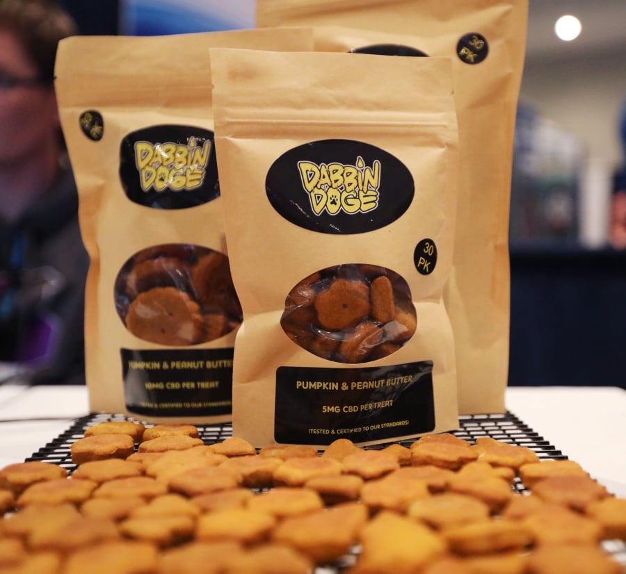 Dog treats are displayed at the Cannabis World Congress & Business Exposition trade show, Thursday, May 30, 2019 in New York. The treats contain non-psychoactive cannabidiol, CBD. They are marketed by DabbinDoge of New Providence, N.J.