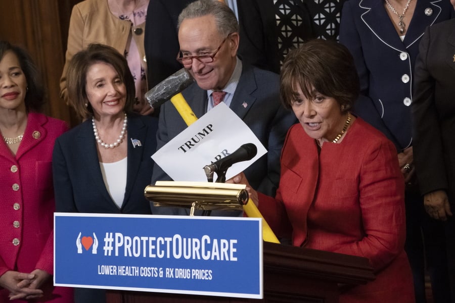 Rep. Anna Eshoo, D-Calif., right, chair of the House Health Subcommittee, says President Donald Trump and Attorney General William Barr want to take a sledgehammer to health care, as she joins, from left, Rep. Lisa Blunt Rochester, D-Del., House Speaker Nancy Pelosi, D-Calif., and Senate Minority Leader Chuck Schumer, D-N.Y., at a Democratic event ahead of a House floor vote on the Health Care and Prescription Drug Package, at the Capitol in Washington, Wednesday, May 15, 2019. (AP Photo/J.
