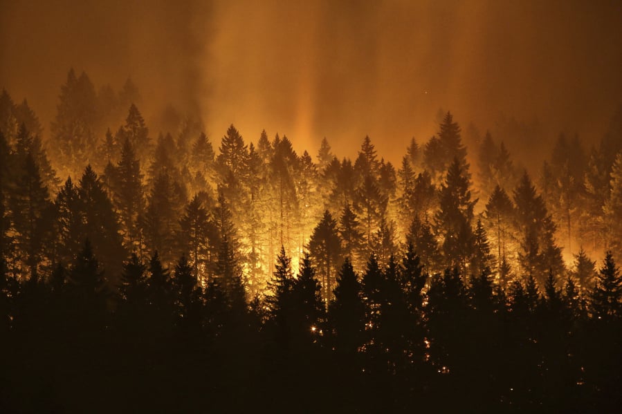 The Eagle Creek wildfire burns in September 2017 on the Oregon side of the Columbia River Gorge near Cascade Locks, Ore.