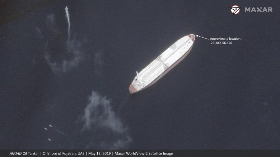 This satellite image provided by Maxar Technologies shows the Saudi-flagged oil tanker Amjad off the coast of Fujairah, United Arab Emirates, Monday, May 13, 2019. As many as four oil tankers anchored in the Mideast were damaged in what Gulf officials described Monday as a “sabotage” attack off the coast of the United Arab Emirates.