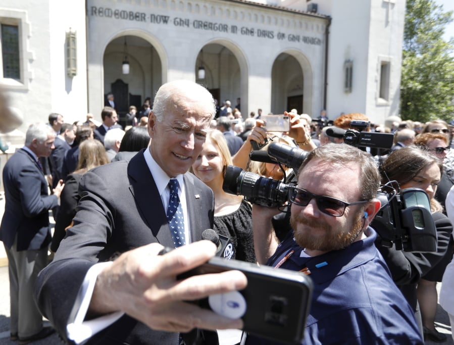 Former Vice President Joe Biden takes a selfie following the funeral for former U.S. Sen. Ernest “Fritz” Hollings at the Summerall Chapel on The Citadel campus Tuesday, April 16, 2019, in Charleston, S.C. Biden delivered one of the eulogies for his former Senate colleague. Hollings died earlier this month at age 97.