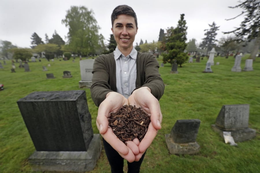Katrina Spade, the founder and CEO of Recompose, a company that hopes to use composting as an alternative to burying or cremating human remains, poses for a photo in a cemetery in Seattle. Spade is hoping to open the first recomposition, or human composting, facility in Seattle by late 2020.