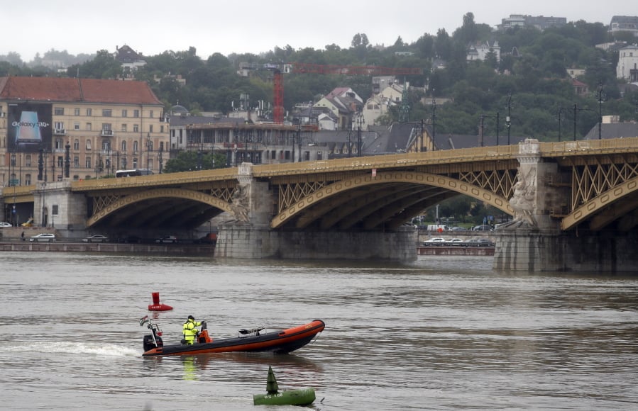 A rescue boat searches for survivors on the River Danube in Budapest, Hungary, Thursday, May 30, 2019. A massive search was underway on the river for missing people after the sightseeing boat with 33 South Korean tourists sank after colliding with another vessel during an evening downpour.