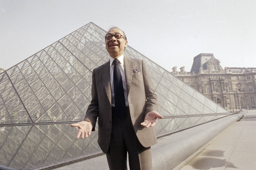 Chinese-American architect I.M. Pei laughs March 29, 1989 in front of the Louvre glass pyramid, which he designed, in the museum’s Napoleon Courtyard prior to its inauguration in Paris.