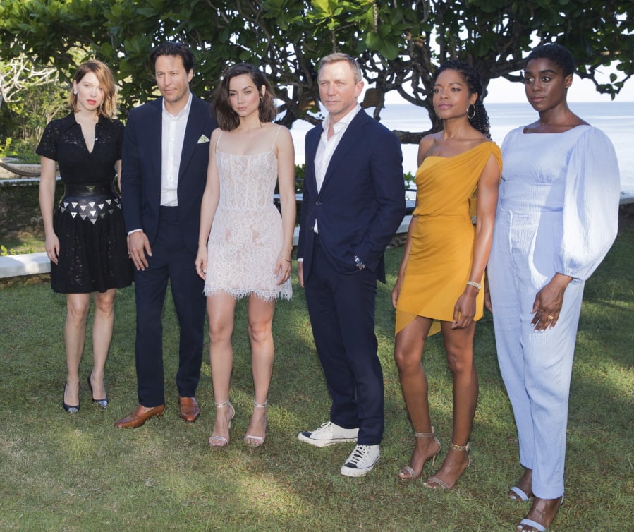 Actress Lea Seydoux, from left, director Cary Joji Fukunaga, actors Ana de Armas, Daniel Craig, Naomie Harris and Lashana Lynch pose for photographers during the photo call of the latest installment of the James Bond film franchise, currently known as ‘Bond 25’, in Oracabessa, Jamaica, Thursday, April 25, 2019.