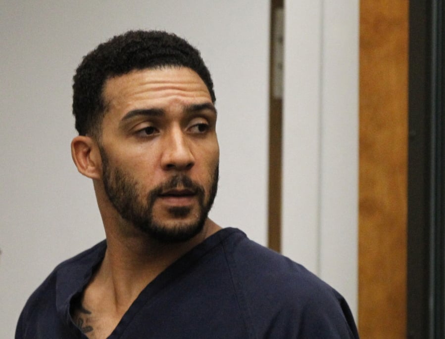 FILE - In this June 15, 2018, file photo, former NFL football player Kellen Winslow Jr., center, leaves his arraignment in Vista, Calif. Winslow, a former NFL No. 1 draft pick and son of a Hall of Famer who starred for his hometown San Diego Chargers, goes on trial Monday, May 20, 2019, on multiple charges including raping two women last year and raping an unconscious 17-year-old girl.