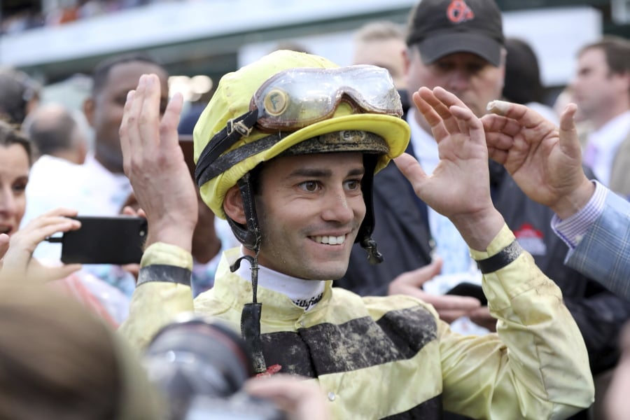 Jockey Flavien Prat reacts learning he won the 145th running of the Kentucky Derby horse race when Maximum Security was disqualified at Churchill Downs Saturday, May 4, 2019, in Louisville, Ky.