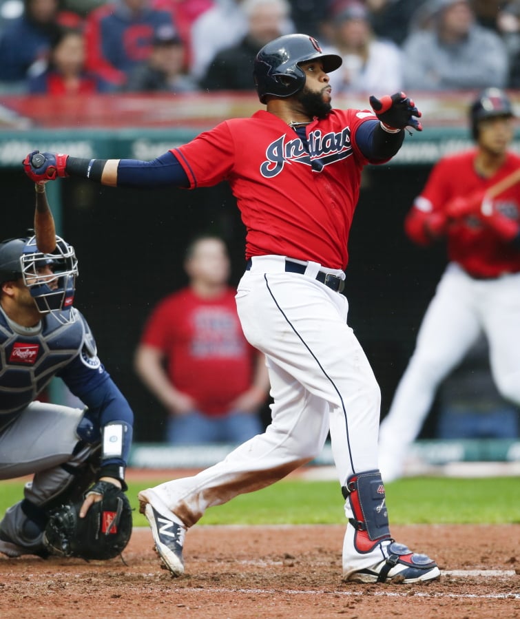 Cleveland Indians’ Carlos Santana hits a two-run home run off Seattle Mariners relief pitcher Connor Sadzeck during the eighth inning of a baseball game, Saturday, May 4, 2019, in Cleveland. The Indians defeated the Mariners 5-4.