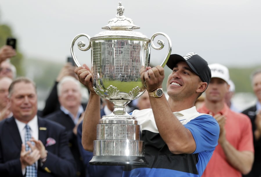 Brooks Keopka holds up the Wanamaker Trophy after winning the PGA Championship golf tournament, Sunday, May 19, 2019, at Bethpage Black in Farmingdale, N.Y.