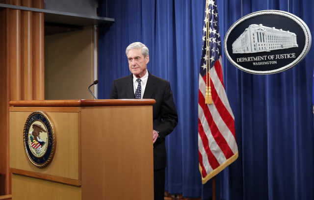 Special counsel Robert Mueller prepares to speak at the Department of Justice Wednesday, May 29, 2019, in Washington, about the Russia investigation.
