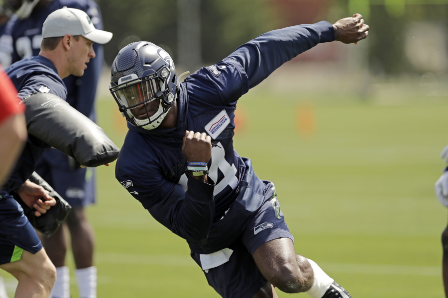 Seattle Seahawks rookie wide receiver DK Metcalf runs a drill during rookie mini camp Friday in Renton. It took one rookie minicamp practice for Metcalf to catch the attention of Seahawks coach Pete Carroll. “Maybe he’s even more unique than we thought coming in,” Carroll says. (AP Photo/Ted S.