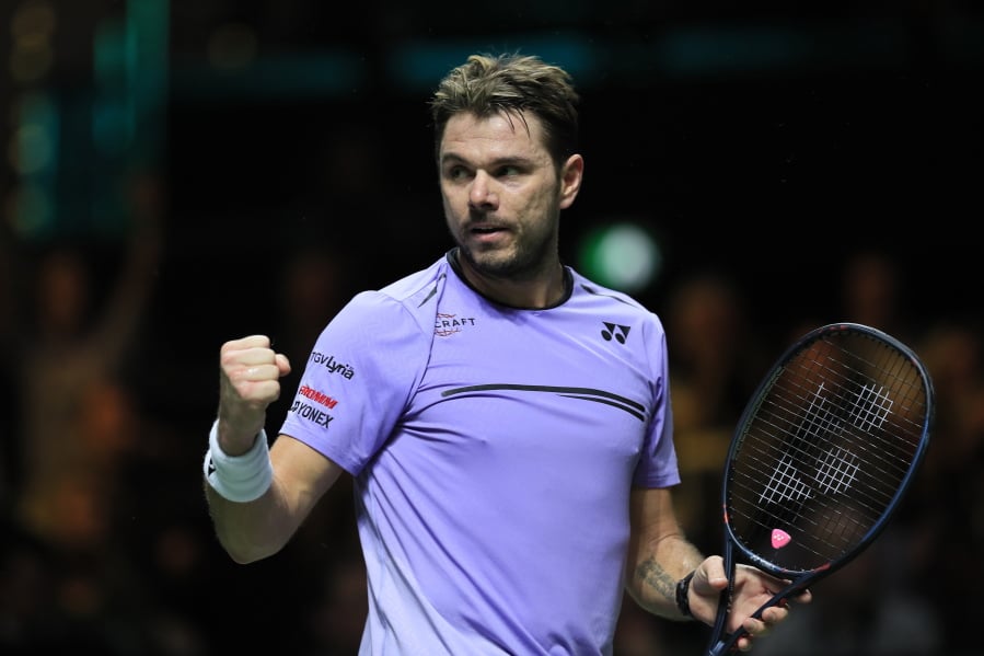 FILE - In this Feb. 17, 2019 file photo, Stan Wawrinka, of Switzerland, clenches his fist after scoring a point against Gael Monfils, of Franc,e in the men’s singles final of the ABN AMRO world tennis tournament at Ahoy Arena in Rotterdam, Netherlands. Three-time Grand Slam champion Wawrinka says there has been a “worrying decline in moral standards” in tennis as “politics have overshadowed the action on the courts.” In a letter published Friday, May 3 in The Times of London, Wawrinka discusses the case of Justin Gimelstob, the ex-player, coach and TV commentator who resigned this week from the ATP board of directors after pleading no contest to misdemeanor assault for attacking a former friend.