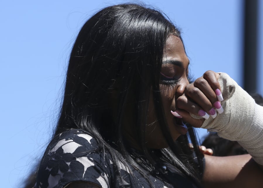 In this Friday, April 20, 2019 photo, Muhlaysia Booker speaks during a rally in Dallas. Booker, a transgender woman seen on a widely circulated video being beaten on April 12 in front of a crowd of people, was found dead Saturday, May 18 in a Dallas shooting. No suspect has been identified.