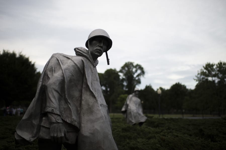 FILE - In this Sept. 19, 2016, file photo shows sculptures by Frank Gaylord at the Korean War Veterans Memorial in Washington. The U.S. military says it has identified the remains of three more Americans killed during the Korean War, even as efforts to recover additional remains have stalled amid souring relations with North Korea.