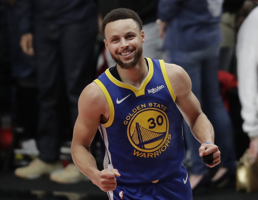 Golden State Warriors guard Stephen Curry reacts at the end of Game 4 of the NBA basketball playoffs Western Conference finals against the Portland Trail Blazers, Monday, May 20, 2019, in Portland, Ore. The Warriors won 119-117 in overtime. (AP Photo/Ted S.