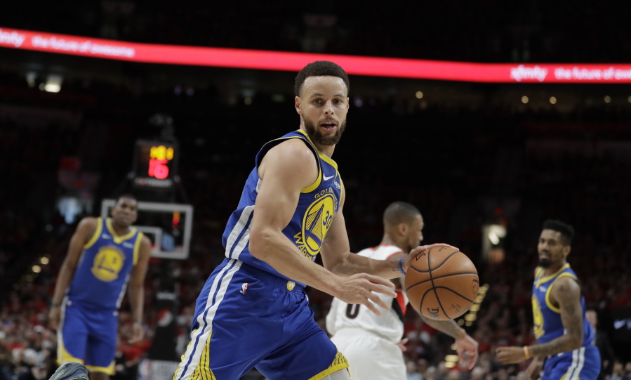 Golden State Warriors guard Stephen Curry (30) dribbles during the first half of Game 4 of the NBA basketball playoffs Western Conference finals against the Portland Trail Blazers, Monday, May 20, 2019, in Portland, Ore. (AP Photo/Ted S.