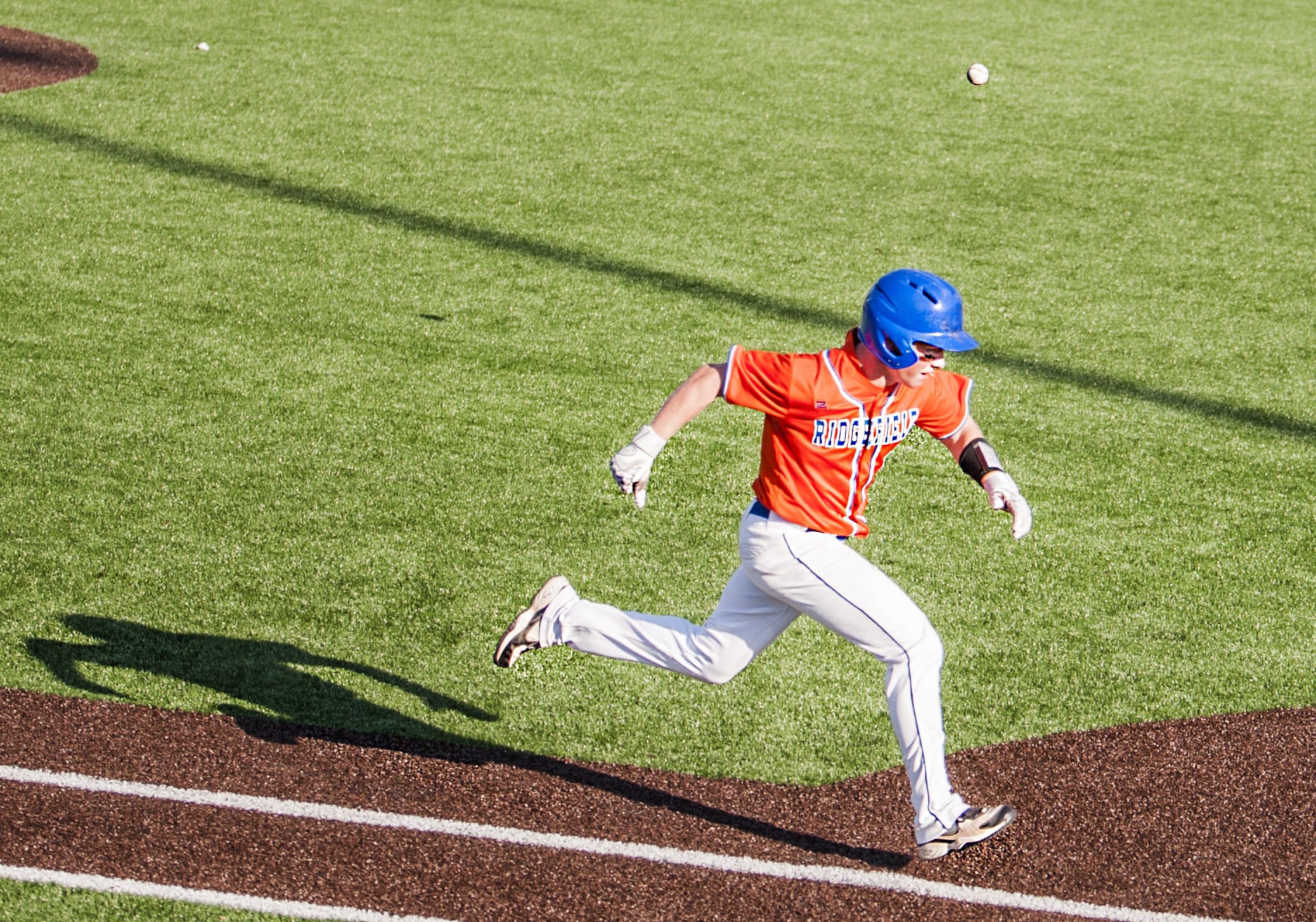 Ridgefield's Clay Madsen tries to beat out a throw in a 2A district championship baseball game Friday at Propstra Stadium. Ridgefield won 4-2.