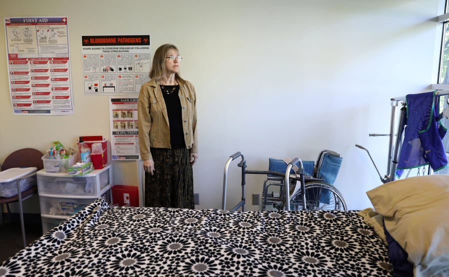 Careforce’s CEO and co-owner Sam Miller, a registered nurse, stands in the room she uses to train new hires of home-care aides May 23 in Lynnwood. The company is weathering a tough labor market.
