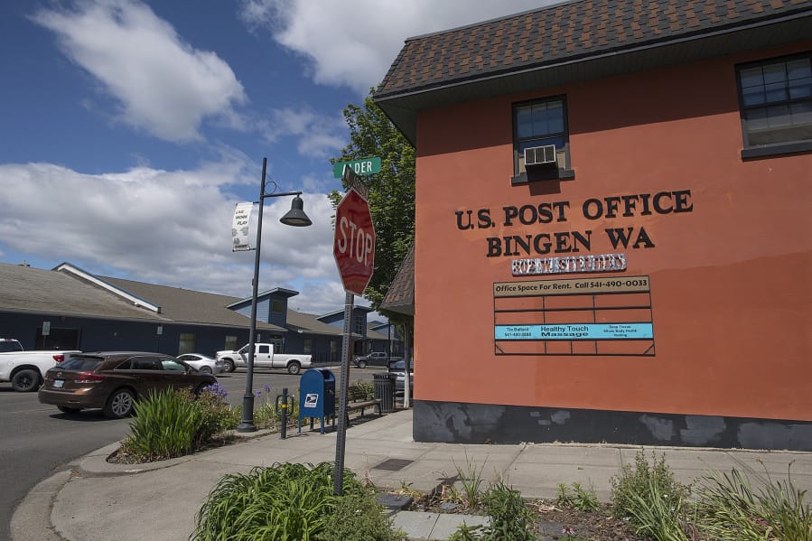 The Insitu offices in downtown Bingen, left, are seen close to the town's post office Wednesday morning, May 24, 2017.