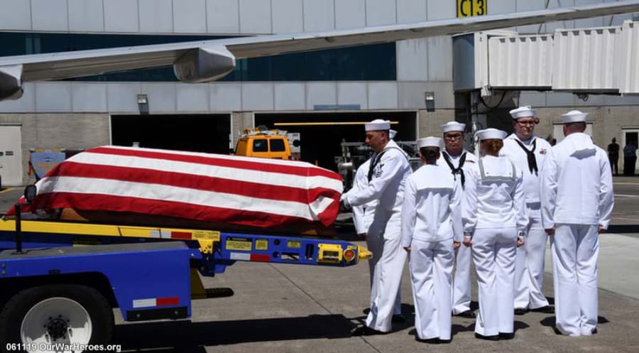 Merle Andrew Smith, who died aboard the USS Oklahoma in Pearl Harbor, is welcomed home Tuesday at the Portland International Airport. Smith’s previously unidentified remains had been buried in an unmarked grave near Pearl Harbor for decades.