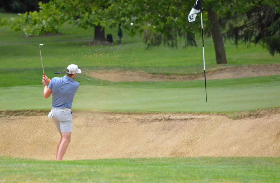 Spencer Tibbits hits out of a sand trap at Portland Golf Club during Saturday's championship round of the Oregon Amateur (Oregon Golf Association photo)