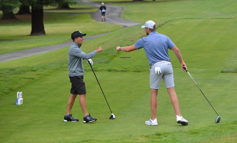 Daniel Snoey of Camas, left, and Spencer Tibbits of Vancouver congratulate each other at Saturday's final at the Oregon Amateur (Oregon Golf Association photo).