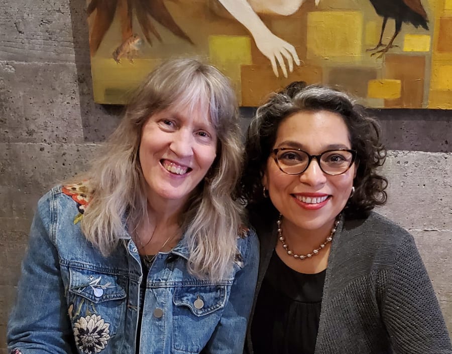 A pair of poet laureates: Gwendolyn Morgan, left, is the poet laureate of Clark County, and Claudia Castro Luna, right, is the poet laureate of Washington. They met at Niche Wine Bar when Luna visited Vancouver earlier this month. Luna has just been awarded a $100,000 grant to conduct poetry readings and workshops along the Columbia River, highlighting the river’s importance.