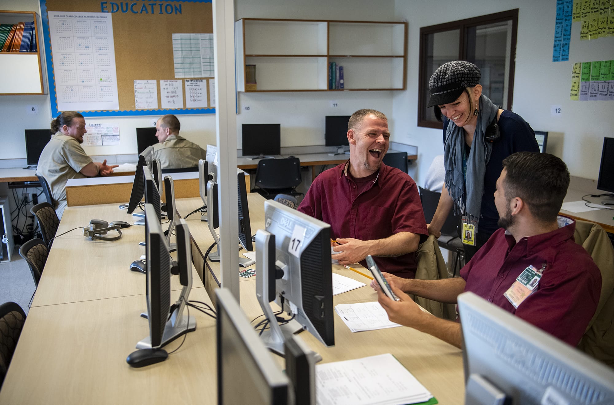 Howard Seaworth, left, and Jakkob McCallin, right, chat with their instructor Lauren Zavrel during her GED class at Larch Corrections Center in Yacolt on Tuesday, May 14, 2019. Zavrel recently got LarchÕs   peer-tutor program accreditation from the College Reading and Learning Association. It is the first corrections center in the country with a peer-tutor program accredited by this national organization.
