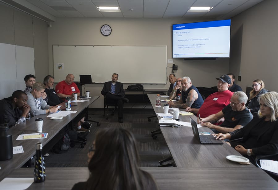 Jim Jensen, center, listens at a Clark County Opioid Task Force meeting in May at Bridgeview Resource Center in Vancouver. The task force is bringing diverse voices together to tackle the opioid epidemic in Clark County.