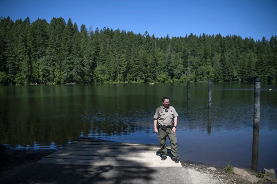 Washington State Parks Area Manager Heath Yeats oversees Battle Ground Lake State Park, where new projects are on the cusp of completion. Three piles are visible in the water behind Yates that will be used for a new ADA-accessible floating dock that will be installed this month. “Folks with limited abilities will be able to go out there and fish,” Yeats said. “It’s a brand-new feature for this park.