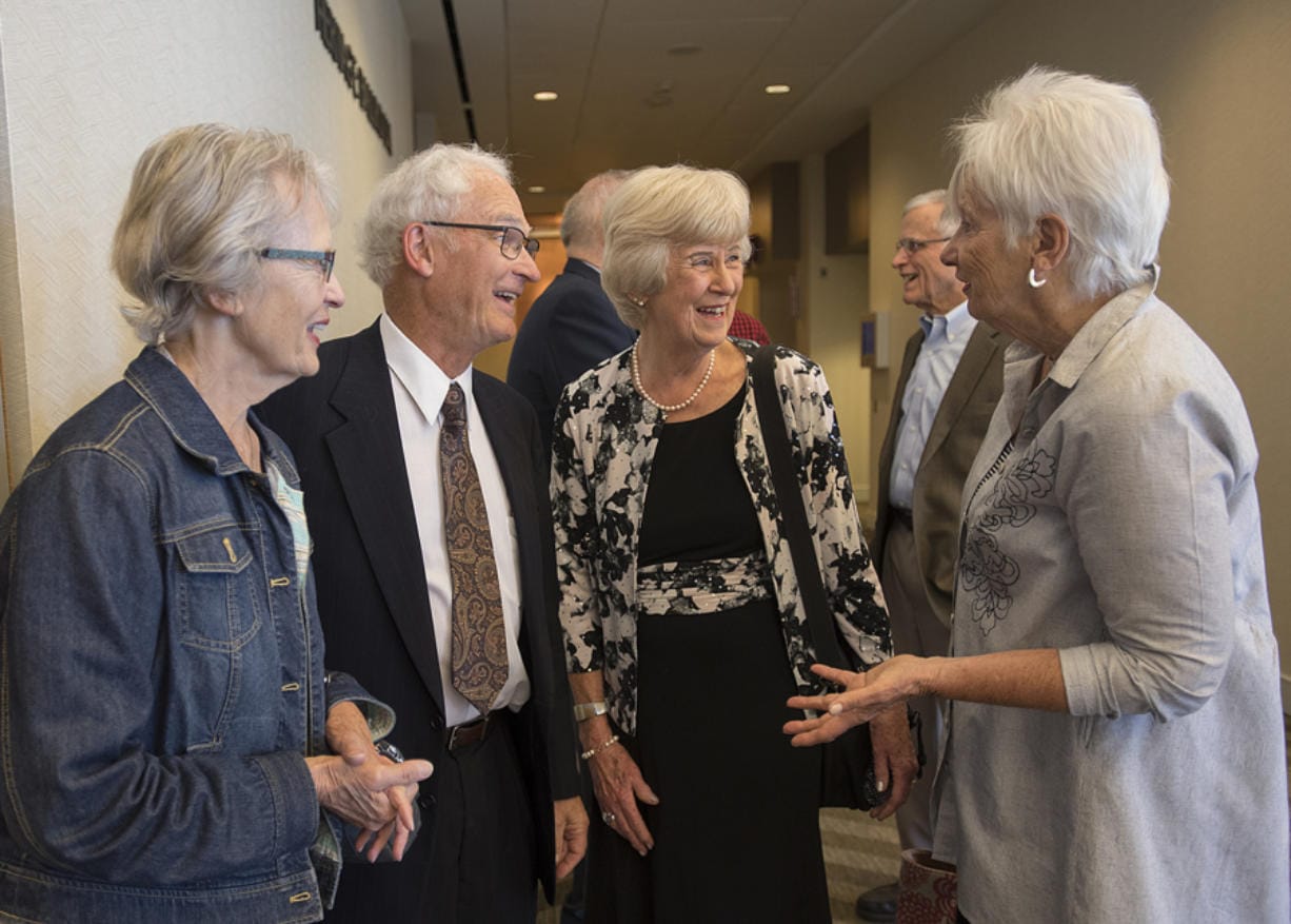 Laura Kalina of Portland, from left, chats with longtime friends Jim and Judith Youde, along with Karen Otis of Beaverton, Ore., before the start of the Community Foundation for Southwest Washington’s luncheon at the Hilton Vancouver Washington Tuesday. The Youdes were honored as the Community Foundation’s 2019 Philanthropists of the Year.