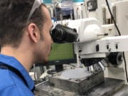 Devon Laverne, a 2018 graduate from Mountain View High School in Evergreen District, works in the laser mark department at SEH America in Vancouver.