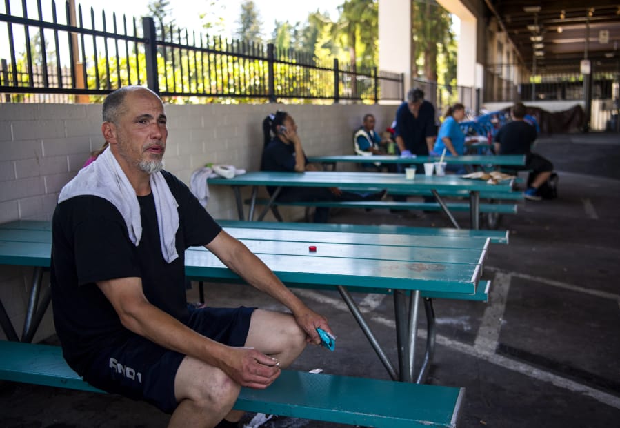 Charles Casey Thompson sits outside the Vancouver Navigation Center for a smoke on Tuesday. Thompson said he thinks the center is an asset for the homeless community, but also the Vancouver community as a whole. “It keeps the germs and disease down,” he said. The Vancouver Navigation Center provides laundry and showers, among other services, to people in need of resources.
