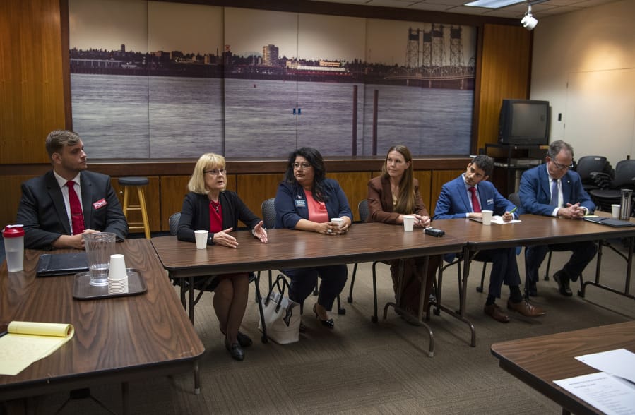 Six of the seven candidates for Vancouver City Council Position 6 meet with The Columbian’s Editorial Board on Tuesday: Mike Pond, from left, Jeanne Stewart, Diana Perez, Sarah Fox, Adam Aguilera and Paul Montague. Not pictured is Dorel Singeorzan, who was unable to attend the meeting.