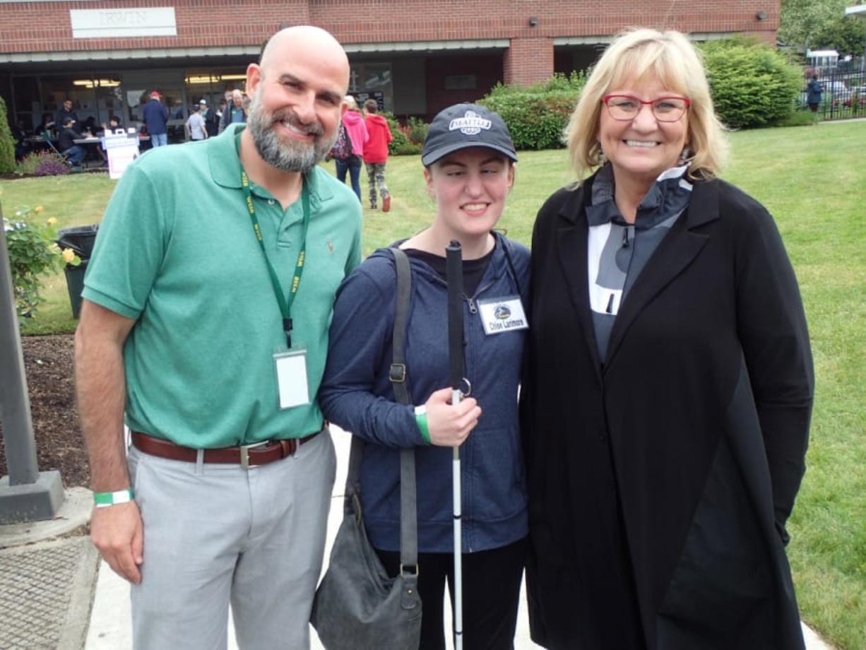 Central Vancouver: First lady Trudi Inslee stands with Scott McCallum, Washington State School of the Blind superintendent, and student athlete Chloe Larimore at a track and field event at the school in May.