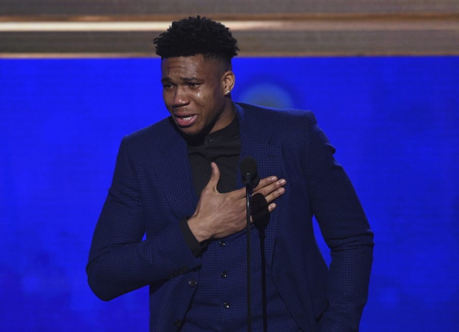 NBA player Giannis Antetokounmpo, of the Milwaukee Bucks, reacts as he accepts the most valuable player award at the NBA Awards on Monday, June 24, 2019, at the Barker Hangar in Santa Monica, Calif.