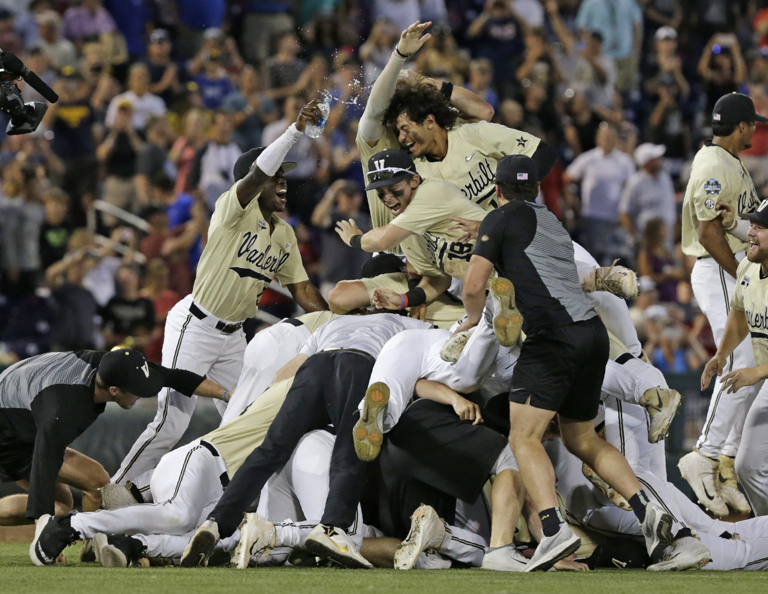Vanderbilt players celebrate after defeating Michigan to win Game 3 of the NCAA College World Series baseball finals in Omaha, Neb., Wednesday, June 26, 2019.