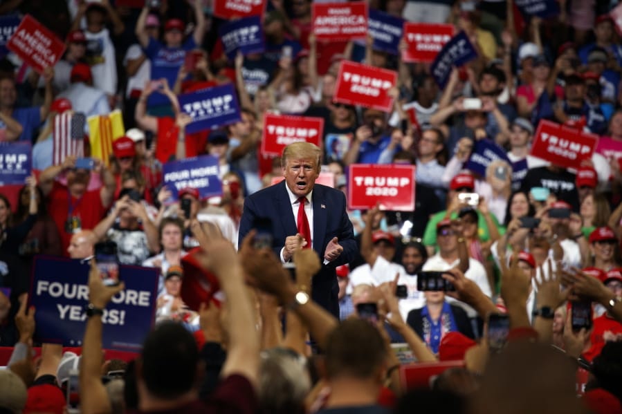 President Donald Trump reacts to the crowd after speaking during his re-election kickoff rally Tuesday in Orlando, Fla.