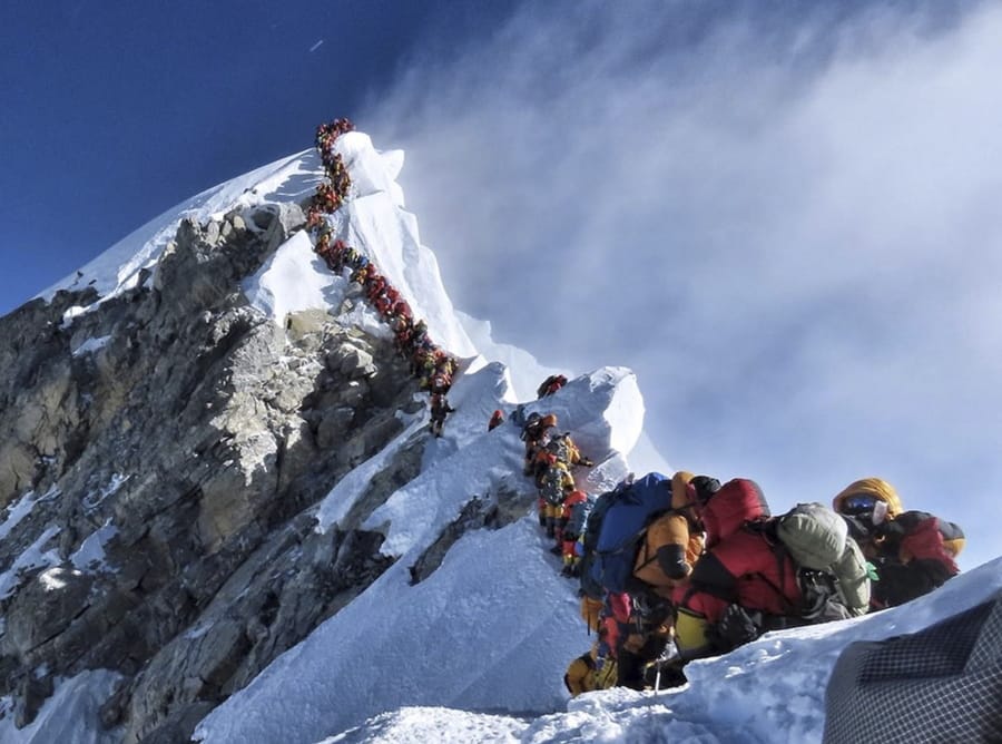 A long queue of climbers line a path to ascend a steep stretch of the route to the summit of Mount Everest on May 22. The photographer, Nirmal Purja, an avid mountaineer, wrote in an Instagram caption that he estimated there were about 320 people in line.