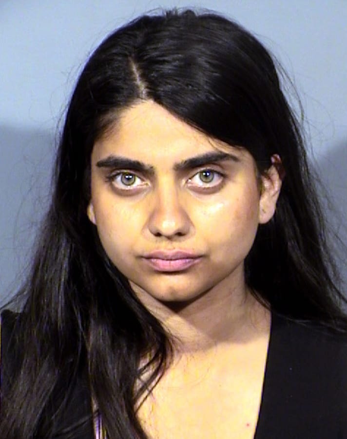 This Thursday, June 6, 2019, mug photo released by the Clark County Detention Center photo shows Priya Sawhney, 30, of Berkley, Calif., following her arrest Thursday, June 6, in Las Vegas on a misdemeanor trespassing charge. Authorities say she was arrested after approaching Amazon CEO and founder Jeff Bezos on stage at a conference at the Aria resort and yelling about chicken farms. The group Direct Action Everywhere publicized Sawhney's protest. Las Vegas police say Sawhney may face additional charges.