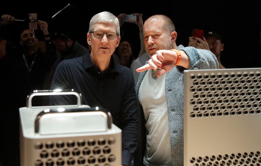 Apple CEO Tim Cook, left, and chief design officer Jonathan “Jony” Ive look at the Mac Pro on June 3 at the Apple Worldwide Developers Conference in San Jose, Calif.