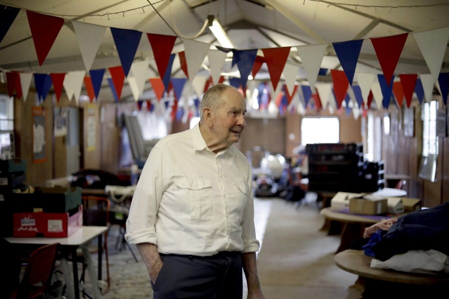 In this photo taken on Thursday, May 23, 2019, British D-Day veteran David Woodrow, 95, who landed at Gold beach and served in 652 squadron of the British Royal Air Force stands in the old mess hall, which during World War II served as part of Hardwick Airfield, on his family’s farm near the village of Topcroft, in Suffolk, eastern England.