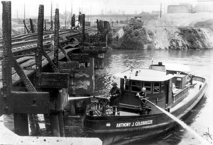 Cleveland firefighters aboard the Anthony J. Celebrezze fire boat extinguish hot spots on a railroad bridge torched by burning fluids and debris on the Cuyahoga River in 1969, in Cleveland. Fifty years after the Cuyahoga River’s famous fire, a plucky new generation of Cleveland artists and entrepreneurs has turned the old jokes about the “mistake on the lake” into inspiration and forged the decades of embarrassment into a fiery brand of local pride.
