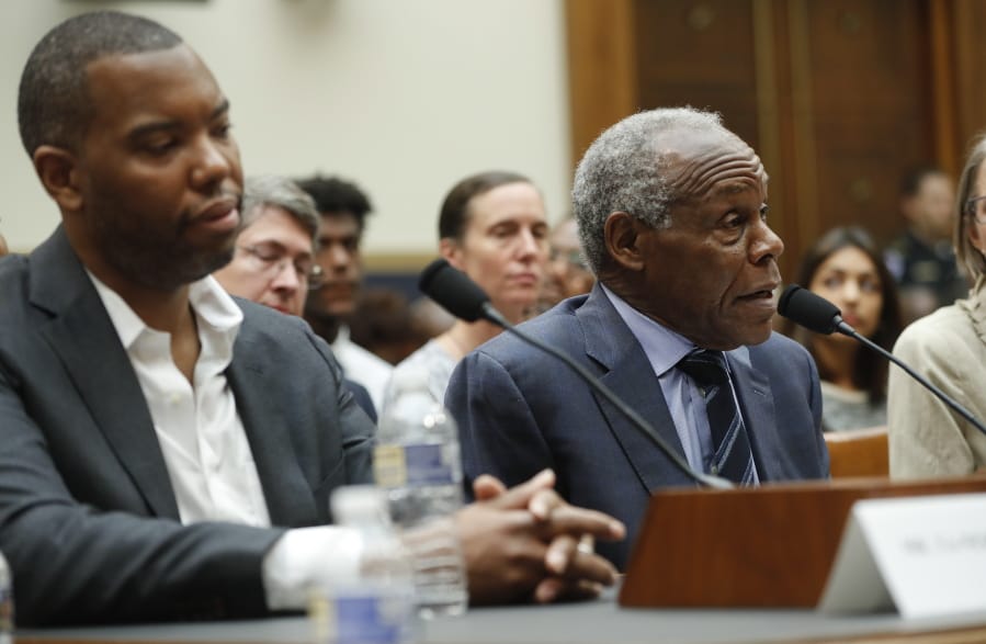 Actor Danny Glover, right, and author Ta-Nehisi Coates, left, testify about reparations for the descendants of slaves Wednesday at a hearing before the House Judiciary Subcommittee on the Constitution, Civil Rights and Civil Liberties in Washington.