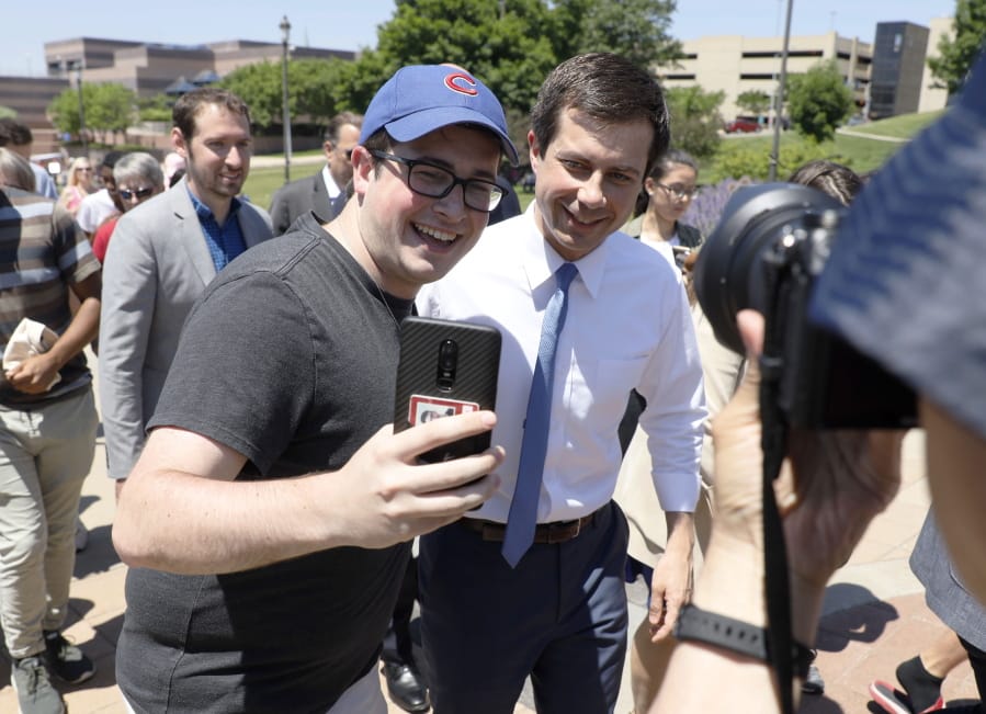 Charlie Neibergall Democratic presidential candidate Pete Buttigieg, right, poses for a selfie during the Capital City Pride Fest, Saturday, June 8, 2019, in Des Moines, Iowa.