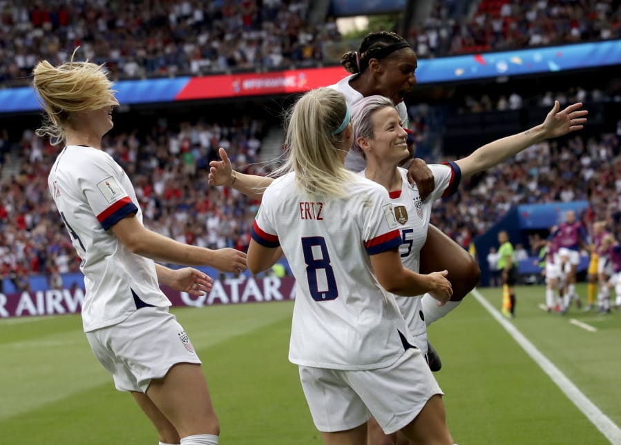 United States’ Megan Rapinoe is congratulated by teammates after scoring her team’s firs goal during the Women’s World Cup quarterfinal soccer match between France and the United States at Parc des Princes in Paris, France, Friday, June 28, 2019.