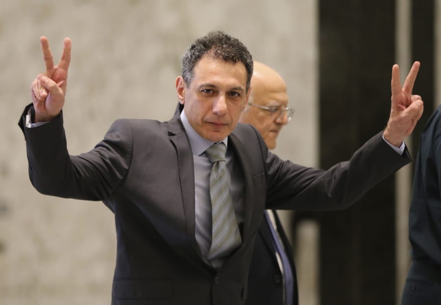 Nizar Zakka, a Lebanese citizen and U.S. permanent resident, who was released in Tehran after nearly four years in jail on charges of spying, flashes victory signs upon his arrival at the presidential palace, in Baabda, east of Beirut, Tuesday, June 11, 2019. Zakka a Lebanese businessman was allowed to fly to Lebanon, a development that comes amid heightened tensions between Iran and the U.S. after President Donald Trump withdrew America from Tehran’s nuclear deal with world powers.