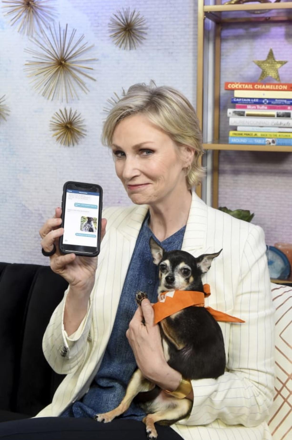 Actress and pet advocate Jane Lynch messages a vet via Vet Chat on Tuesday in New York.